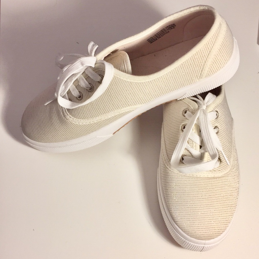 BRAND NEW shoes. White with gold stripes.